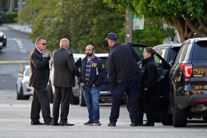 Investigators work outside the home of Paul Pelosi, the husband of House Speaker Nancy Pelosi, in San Francisco on Friday.