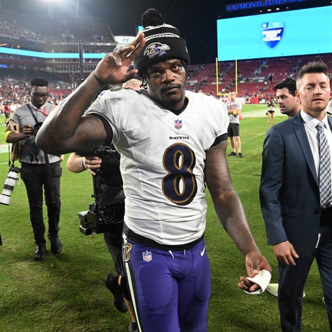 Baltimore Ravens quarterback Lamar Jackson walks o