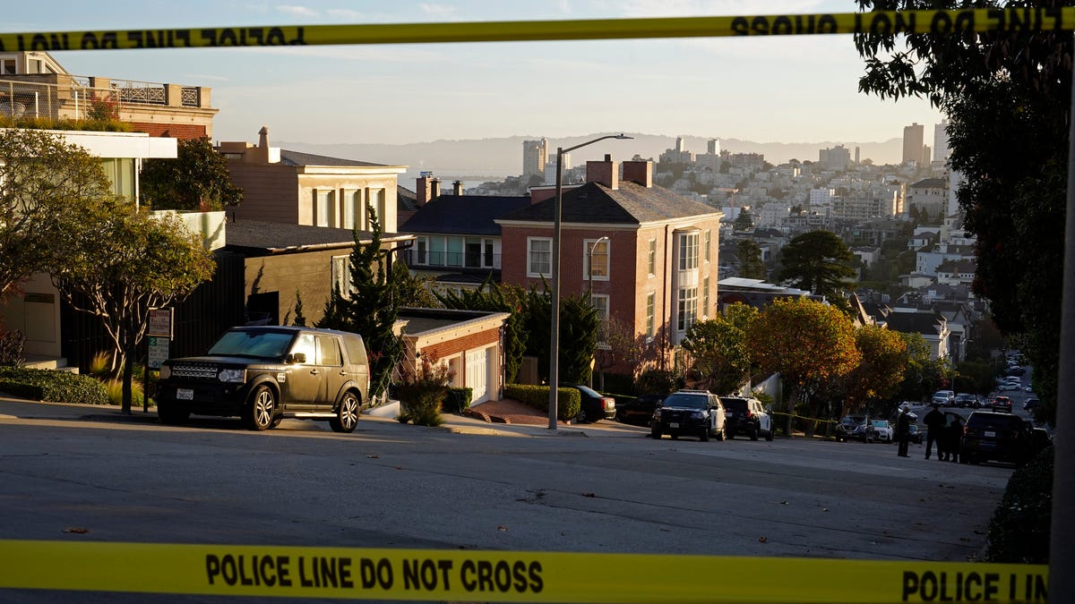 Police tape blocks a street outside the home of Paul Pelosi, the husband of House Speaker Nancy Pelosi, in San Francisco. Paul Pelosi was attacked in the home early Friday.