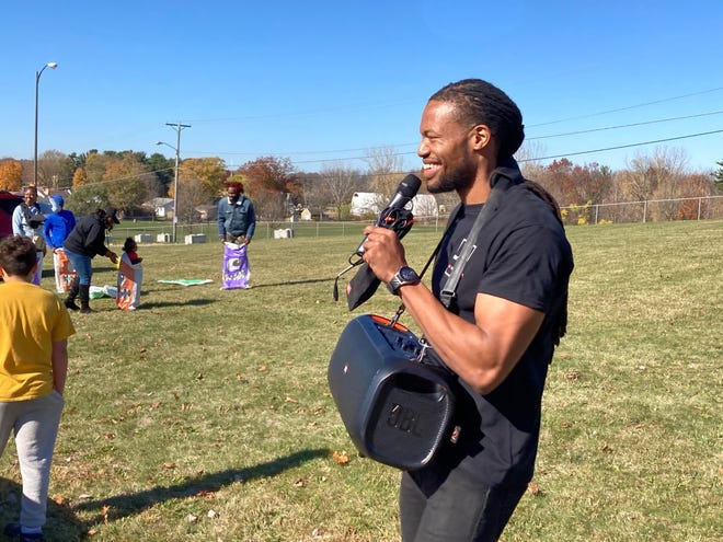 Hassan Anderson, owner of the Northeast Health and Business Center, organized a sack race Saturday during the building's Halloween open house. Anderson is reviving the former Northeast Community Center at 2600 25th St.  NE is in Guangzhou.