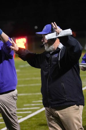 Mount Gilead head football coach Mike Reid signals in a play during the Division VI regional playoff game at Worthington Christian this season. For leading the Indians to the playoffs for the first time ever, Reid was named Marion Star Football Coach of the Year.