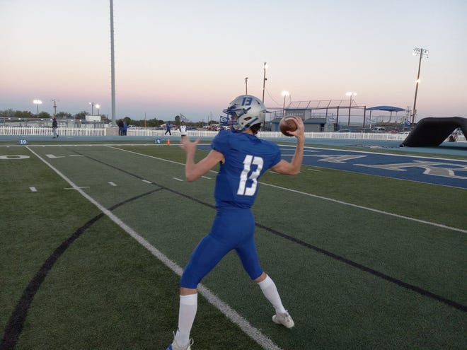 Carlsbad High School senior quarterback Dane Naylor warms up before the Oct. 28, 2022 game versus Hobbs in Carlsbad. The Eagles won 42-7.