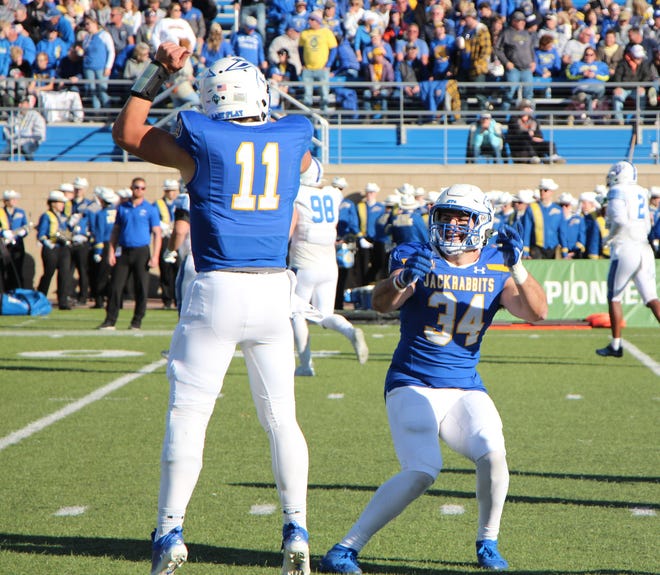 Mark Gronowski (11) and Mike Morgan celebrate their touchdown connection in Saturday's 49-7 win over Indiana State.