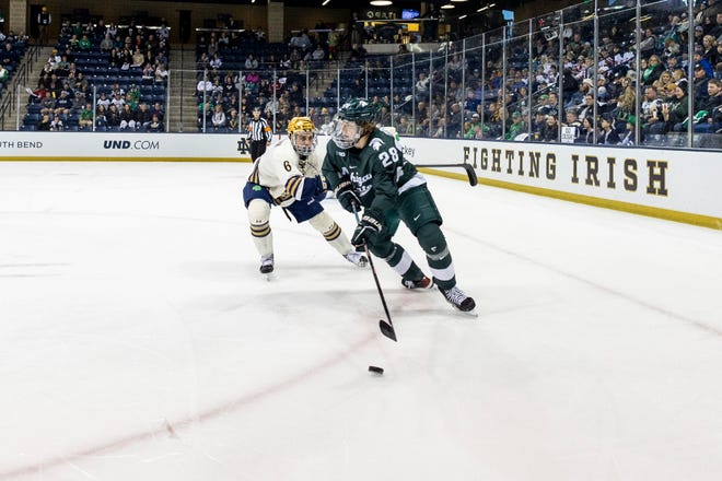 Michigan State forward Karsen Dorwart (28), shown handling the puck in a game last month at Notre Dame, had two goals and two assists in the Spartans' 7-3 win over No. 6 Penn State on Saturday night.