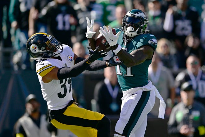 Philadelphia Eagles wide receiver A.J. Brown (11) catches a touchdown pass while being defended by Pittsburgh Steelers safety Minkah Fitzpatrick (39) during the first half of an NFL football game between the Pittsburgh Steelers and Philadelphia Eagles, Sunday, Oct. 30, 2022, in Philadelphia. (AP Photo/Derik Hamilton)