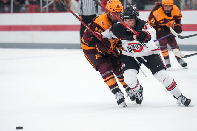 Oct 29, 2022; Columbus, Ohio, USA;  Ohio State University forward Paetyn Levis (27) and University of Minnesota forward Abbey Murphy (18) race towards the puck during the third period at Ohio State Ice Rink. Mandatory Credit: Joseph Scheller-The Columbus Dispatch