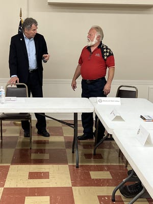 U.S. Sen. Sherrod Brown speaks to Richard McClellan, director of the Portage County Veterans Services Commission. Brown was at the Ravenna VFW on Monday to speak about the PACT Act, which expands benefits to veterans exposed to toxic substances during their military service.