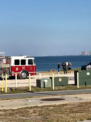 Rescue workers were called to Pensacola Beach Monday afternoon after a car was driven into the Bay near Grand Marlin.