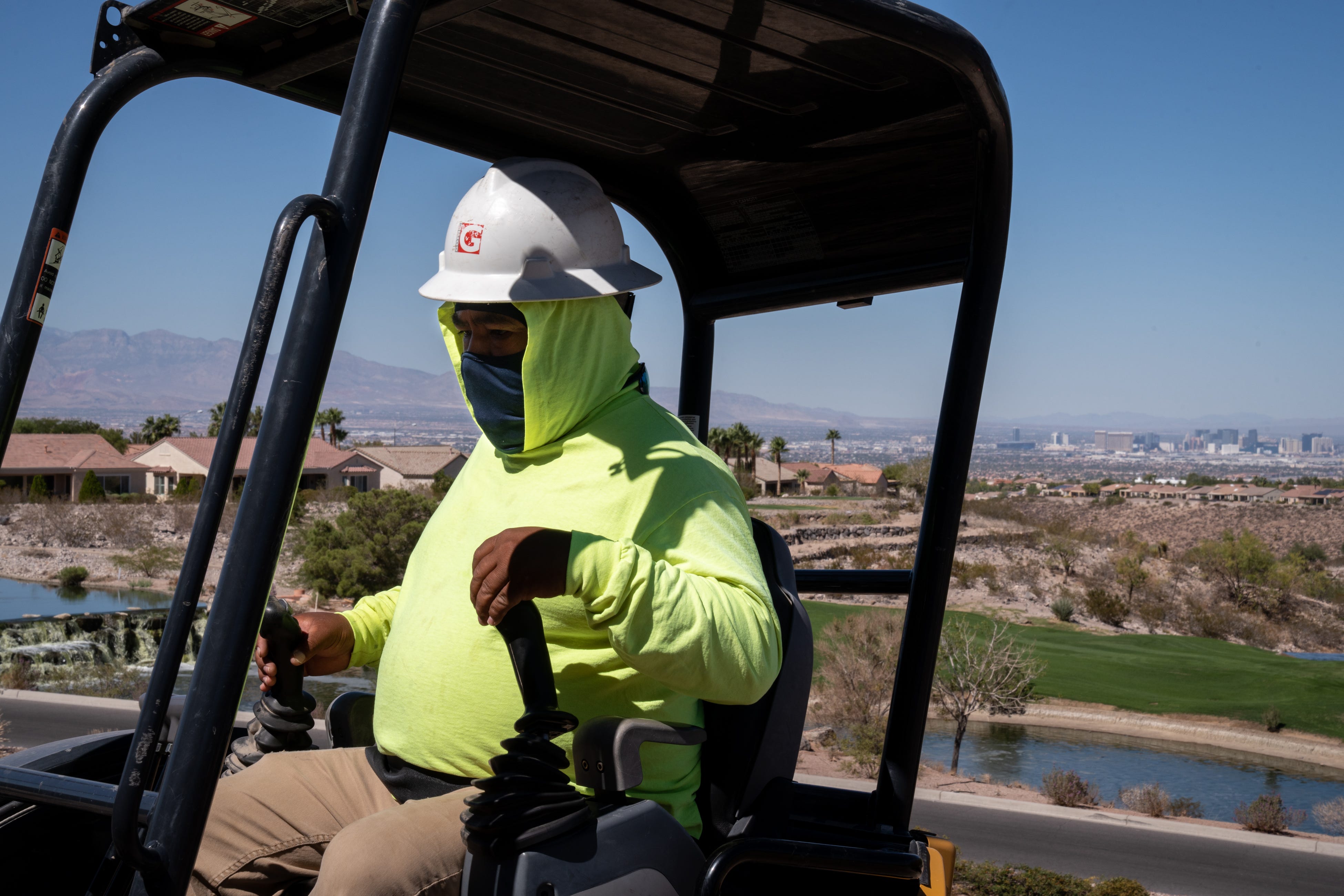 Jose Colorado works on a turf conversion/removal project on Sep. 26, 2022, at the community recreation center in Sun City Anthem in Henderson, Nevada.