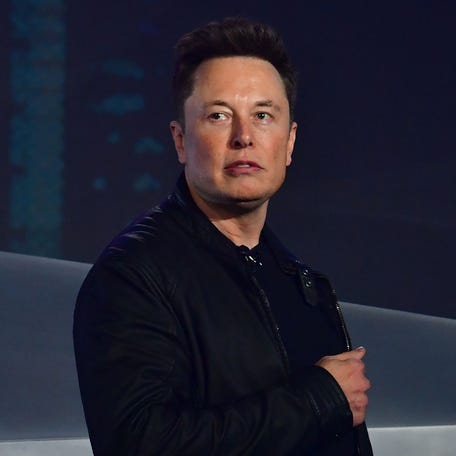 In this file photo taken on November 21, 2019 Tesla co-founder and CEO Elon Musk introduces the newly unveiled all-electric battery-powered Tesla Cybertruck at Tesla Design Center in Hawthorne, California.