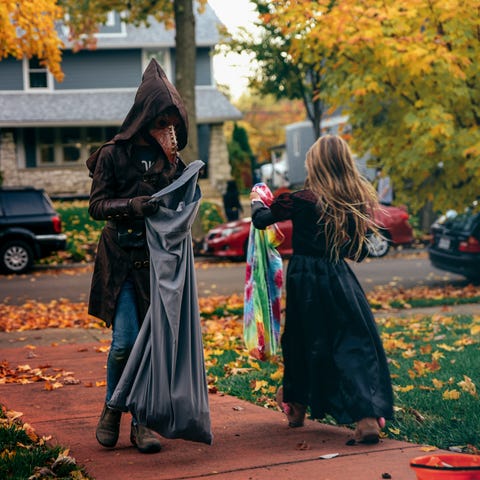 Trick-or-treaters observe social distancing during