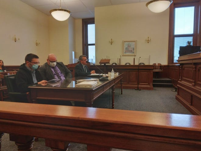 Dalbert W. "Dale" Sanders, left, reviews a plea agreement in Tuscarawas County Common Pleas Court on Tuesday while seated with his attorney John Watters II. Also shown, at right, is County Prosecutor Ryan Styer. Dalbert pleaded guilty to involuntary manslaughter and other charges tied to the May shooting death of John Q. Bashline, II.