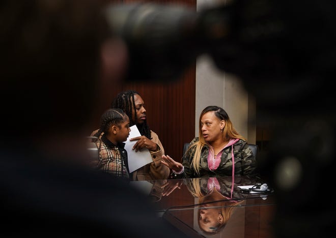 Michelle Wilson, right, aunt of the late Porter Burks, speaks with a sibling before attorney Geoffrey Fieger speaks during a press conference at his office in Southfield on Wednesday, November 1, 2022. Fieger announced he would be filing a lawsuit on behalf of the family of the 20-year-old who was experiencing a mental health crisis while wielding a 3.5 inch knife before it was believed that 15 bullets may have struck and killed Porter after five Detroit police officers shot 38 rounds at Burks.