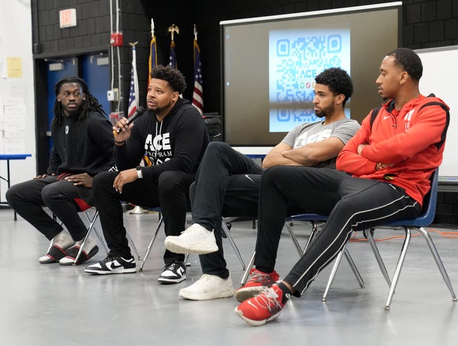 Former OSU men's basketball player George Reese, second from left, speaks during the introduction of a coaching and life skills program for freshmen at Independence High School. Current OSU players Isaac Likekele, far left, and Zed Key, far right, as well as former player Seth Towns, second from right, were also in attendance in support of the program.