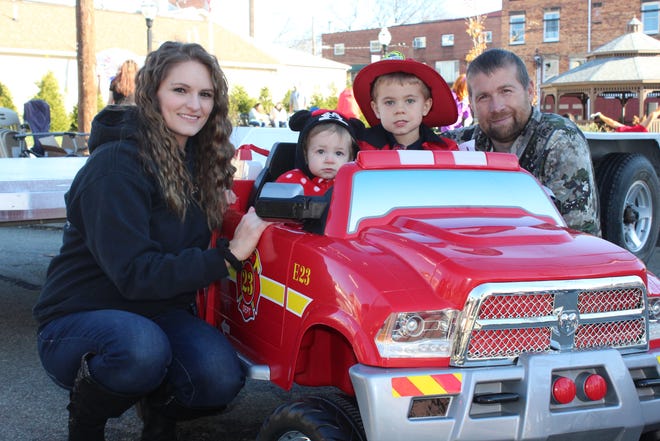 The Dewitt children won for their creative firemen entry during the Meyersdale Halloween parade on Saturday afternoon. Pictured here is Lincoln, 3, and Madilynn, 10 months, with their parents, Amanda and John Dewitt of Salisbury.