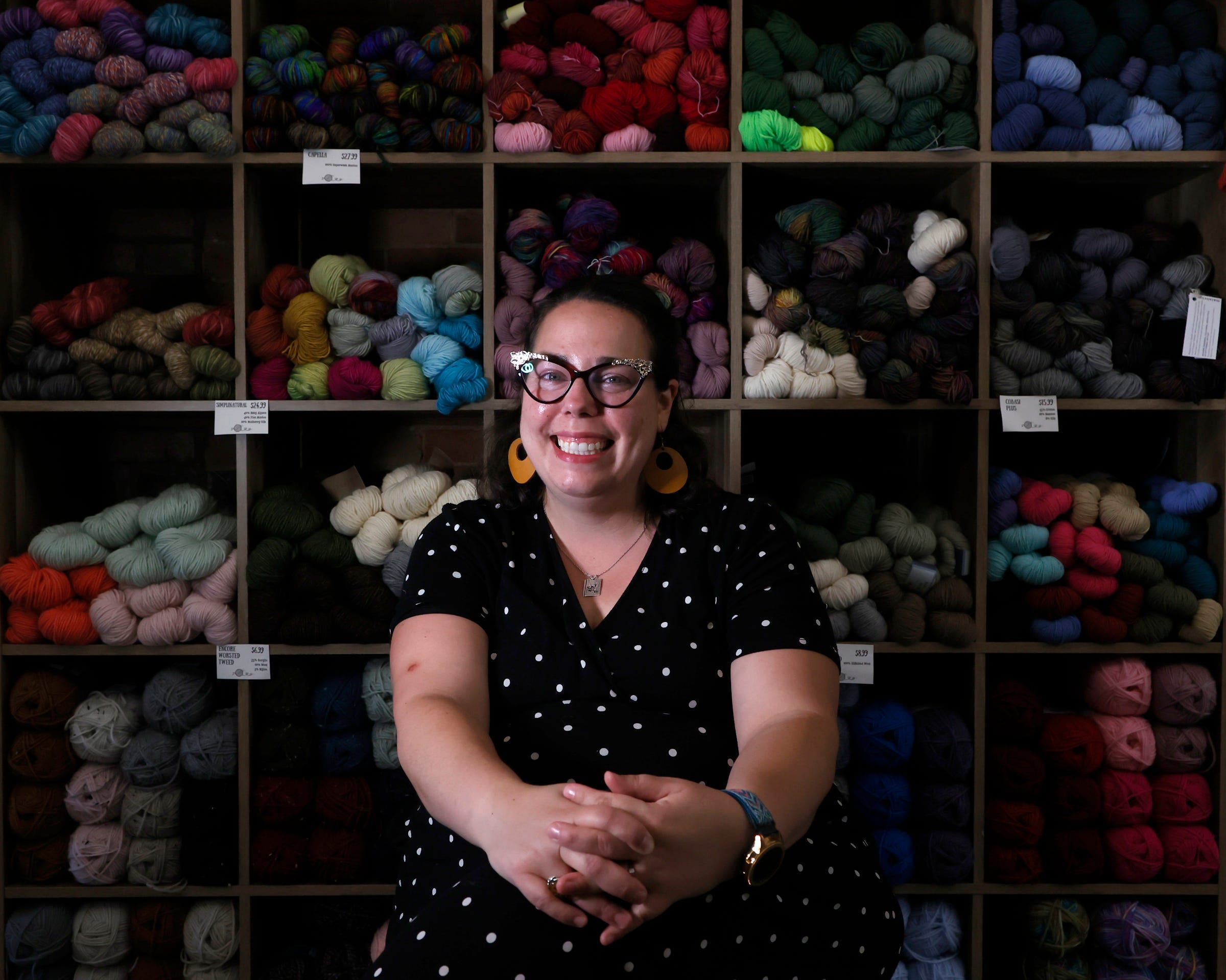 Michelle Beechler, owner of Tink and The Frog, inside her knitting store in Adrian on Sept. 1, 2022. Beechler taught at nearby Adrian College but left the school over disagreements with the school administration. She opened her popular store in March 2021.