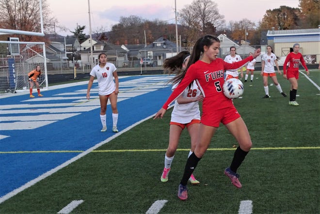 Fairfield Union senior Chloe Thompson keeps the ball away from a Marietta defender during Tuesday's Division II regional semifinal at Chillicothe's Hernstein Field. The Lady Falcons lost 2-1 in overtime.
