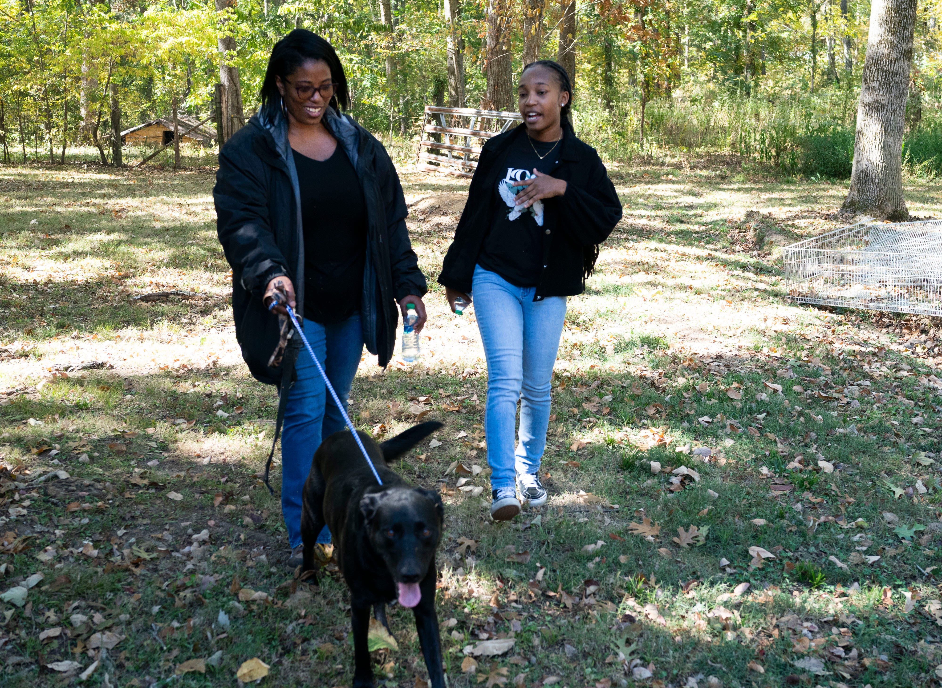 Tennessean opinion and engagement writer Kyra Watts, right, visits with Monica Wilder of Out the Mud Farm Oct. 10, 2022, in Murfreesboro, Tennessee.