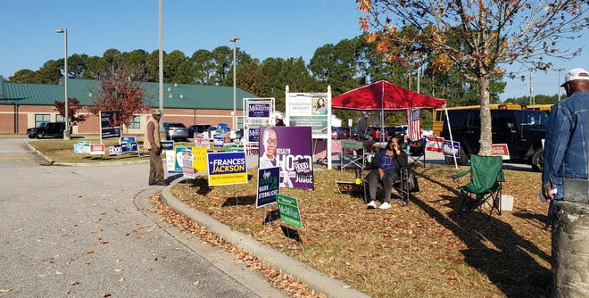 Campaign workers are set up at Stoney Point Recreation Center at 7411 Rockfish Rd on Thursday, Nov. 3, 2022. The center is an early voting site for the midterm and local elections.