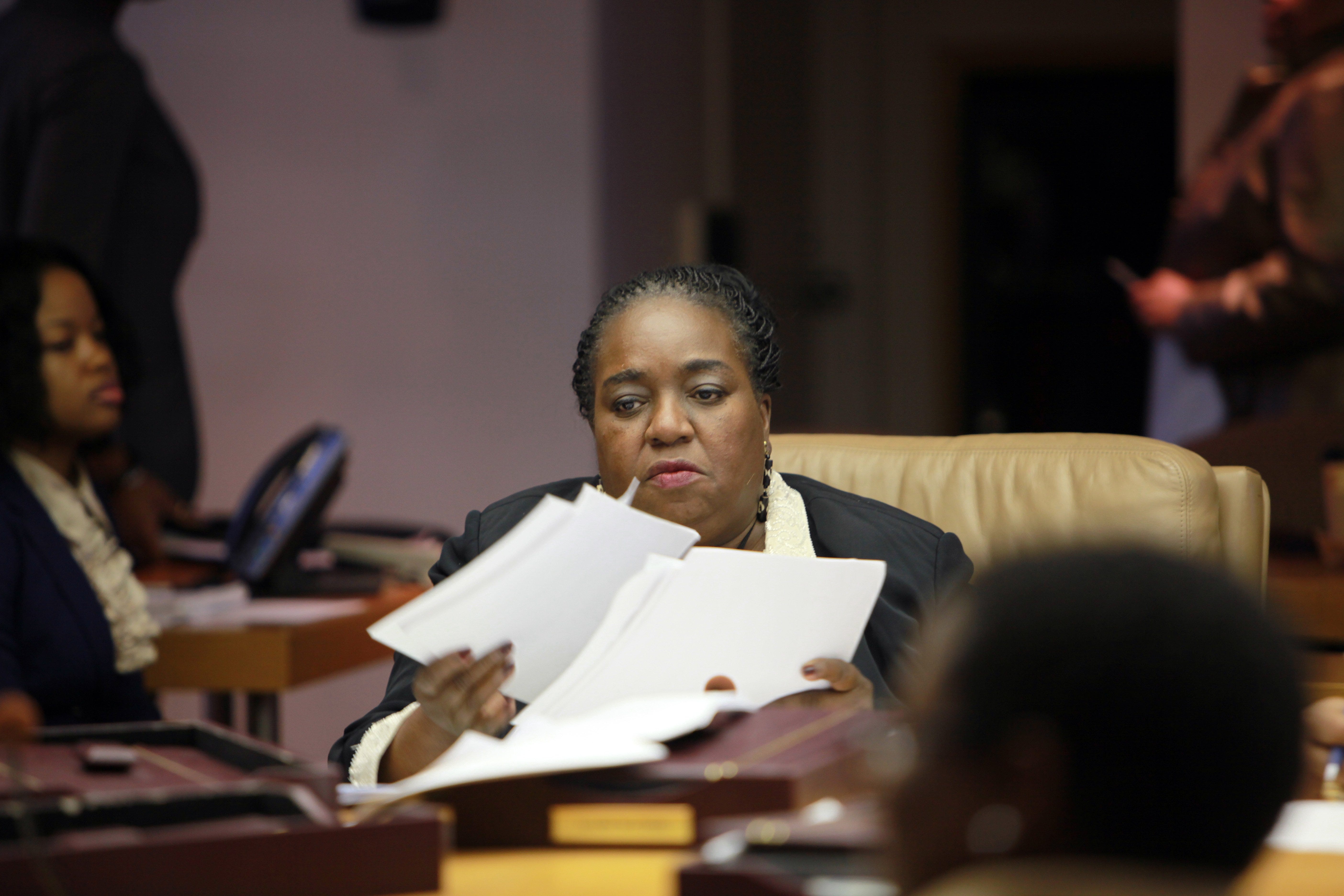 Councilwoman JoAnn Watson goes over some papers before casting her 'no vote" against borrowing $137 million bond money to help the city through its cash flow crisis. during a city council meeting on March 27, 2012.