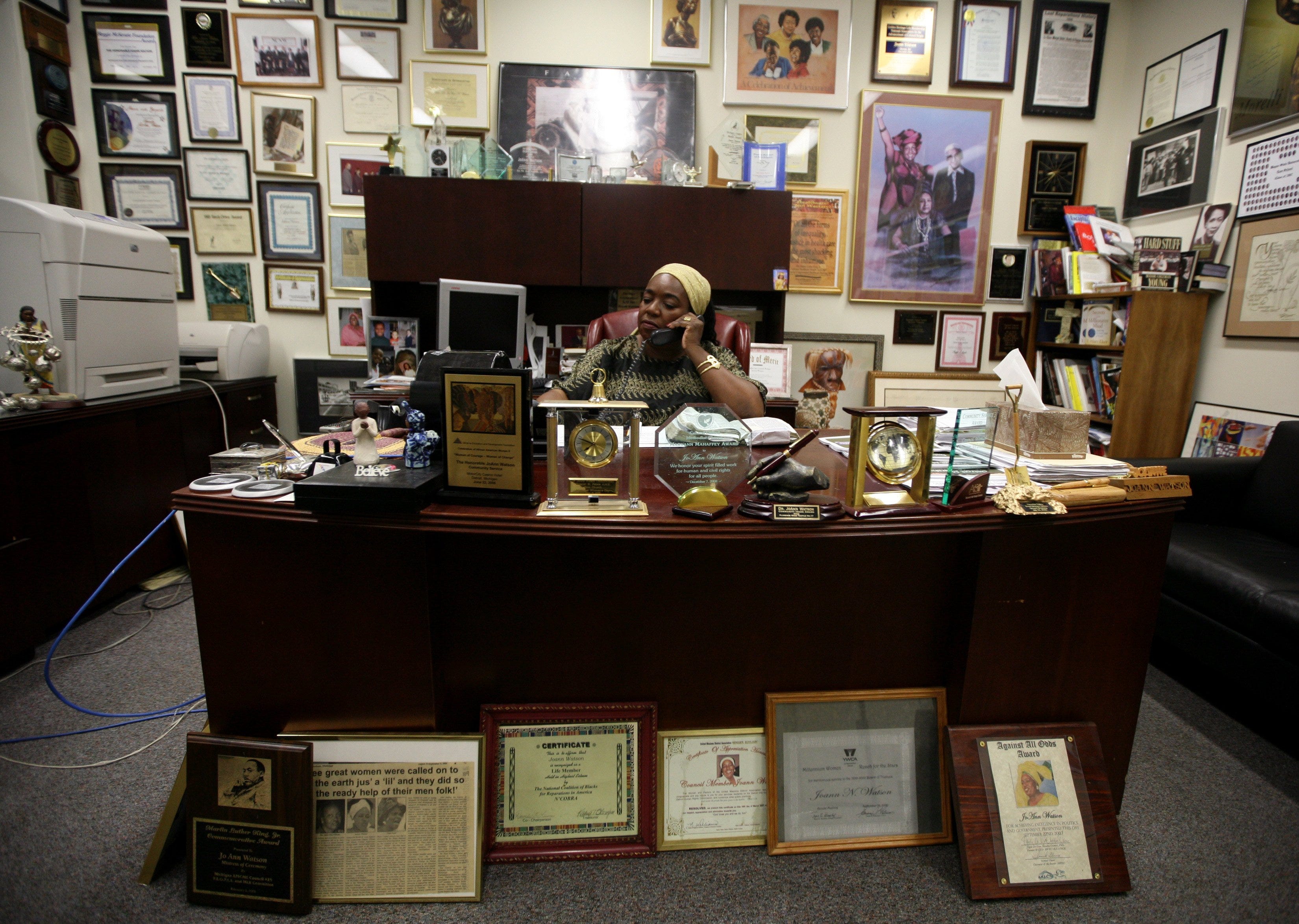 Detroit Councilwoman JoAnn Watson sits at her desk surrounded by countless awards while in her office at the Coleman A. Young Municipal Center in Detroit on October 23, 2009.