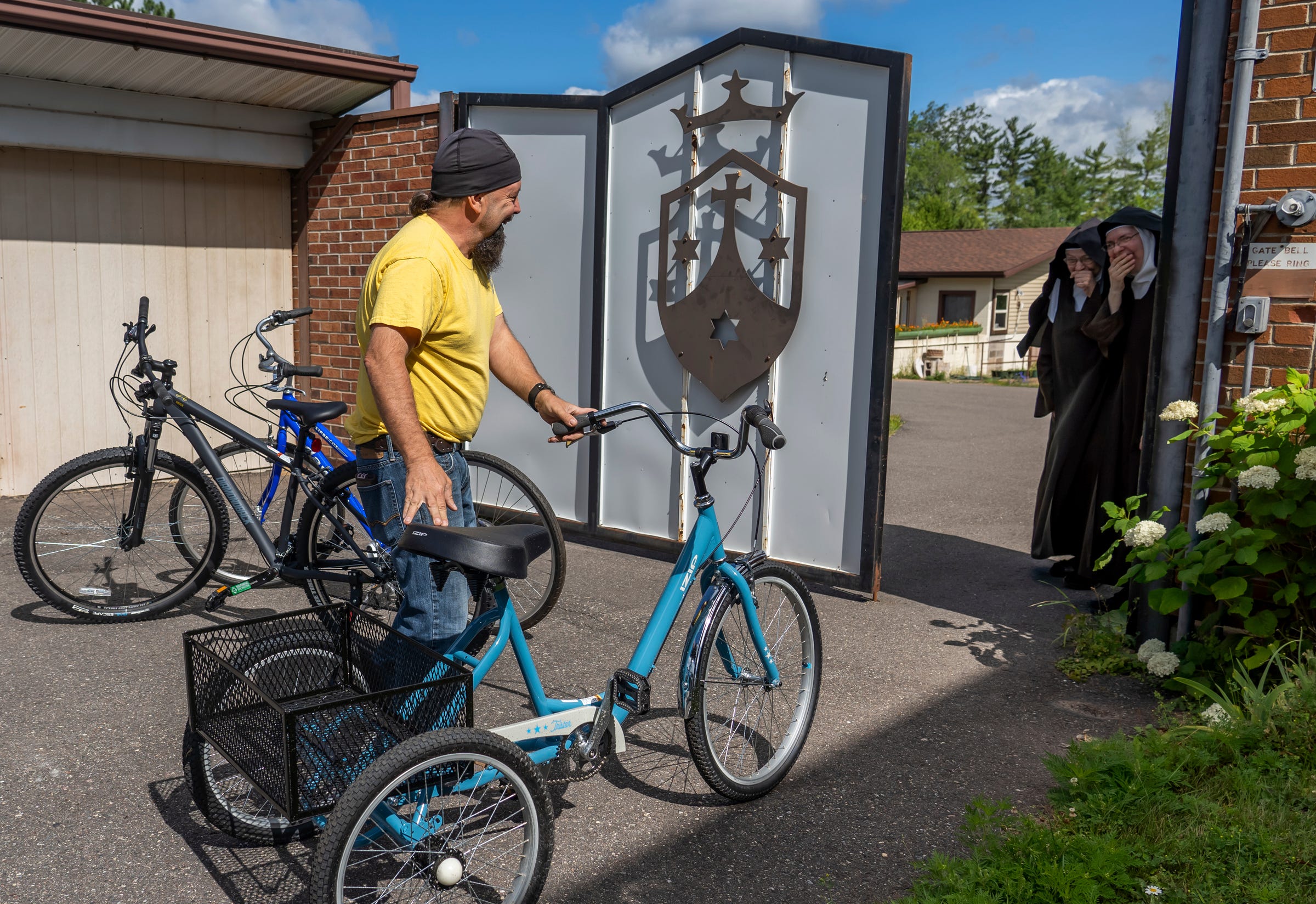 Steven Pringle, owner of Build a Bicycle - Bicycle Therapy, delivers three bikes as donations to surprised nuns at the Carmelite Monastery of the Holy Cross in Iron Mountain on Friday, July 29, 2022. Years ago, when he was struggling, Pringle wrote to the nuns asking for their prayers, and ever since then, he tries to return the favor by bringing unannounced gifts.