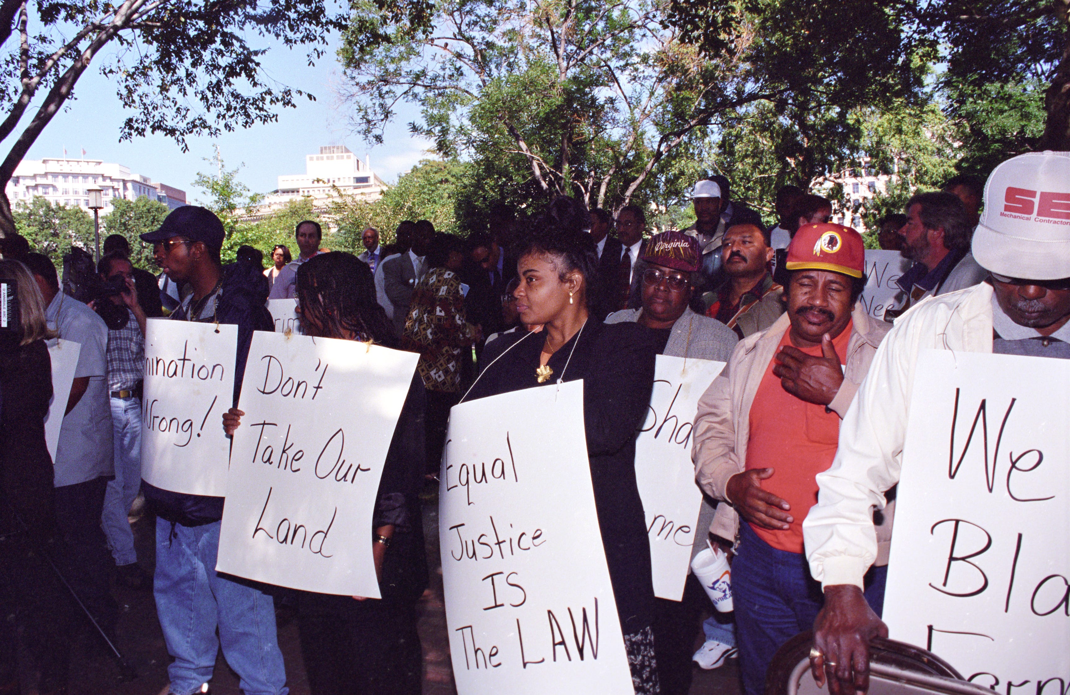 Black farmers protest at Lafayette Park across from the White House in Washington, D.C., on Sept. 22, 1997. Protesters alleged the U.S. Department of Agriculture (USDA) denied black farmers equal access to farm loans and assistance based on their race. North Carolina farmer Timothy Pigford and 400 other black farmers filed the Pigford v. Glickman (Pigford I) class-action lawsuit against USDA in 1997. The USDA settled Pigford I in 1999.