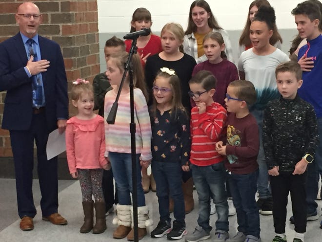 Shelby City Schools Superintendent Tim Tarvin leads students in saying the pledge of allegiance at the beginning of Wednesday's dedication of the new Pre-K-8 building.