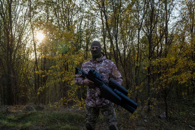 A Ukrainian soldier stands with an anti-drone gun outside Mykolaiv, on Nov. 2, 2022, amid the Russian invasion of Ukraine.
