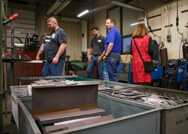 Cole Dow, left, on Thursday shows Salina Vortex professionals around the welding shop at Salina Central High School. Dow teaches welding at USD 305.