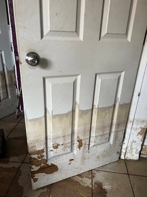 This door inside the rental home of Rusty and Jessica Foltz shows multiple water levels in the aftermath of Myakka River flooding in the aftermath of Hurricane Ian.