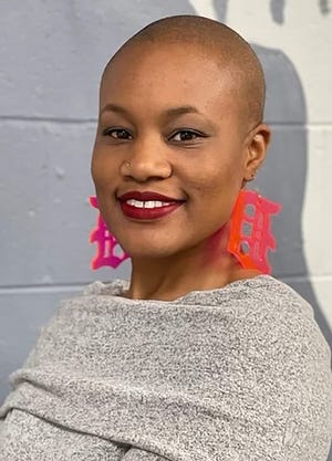 Yolanda Nichelle Curry with her signature earrings.