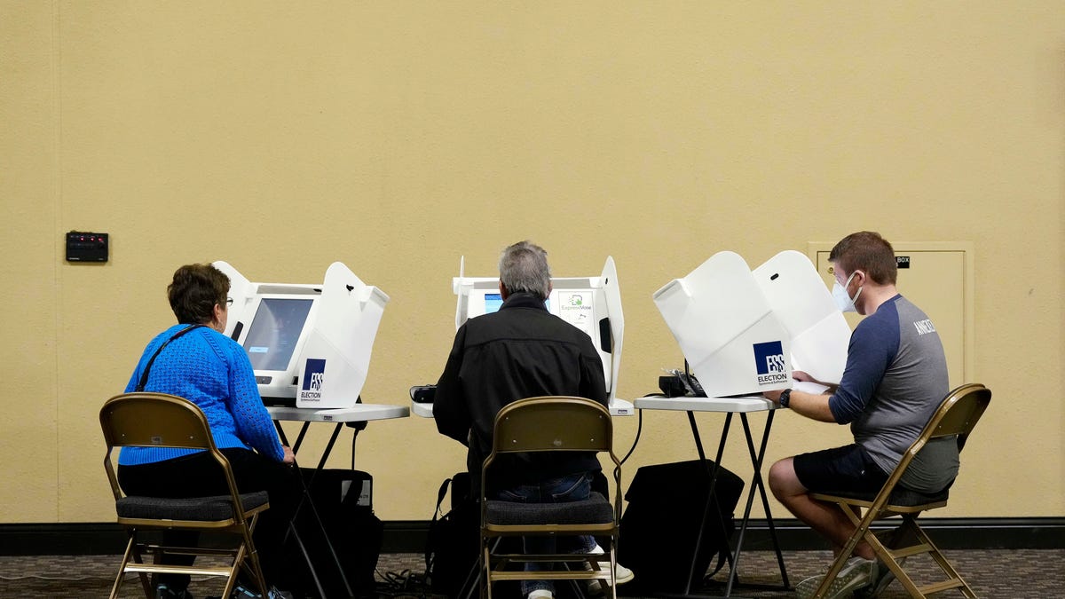 Early voters fill electronic ballots at the Northern Kentucky Convention Center in Covington, Ky., on Thursday, Nov. 3, 2022.