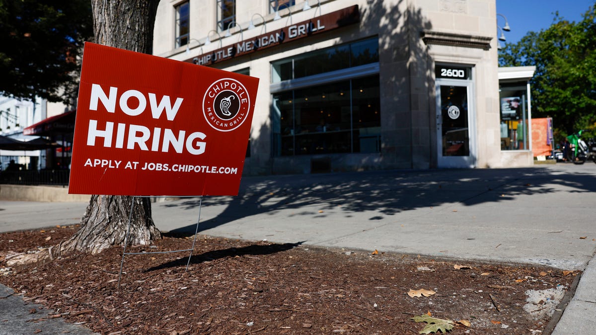 WASHINGTON, DC - OCTOBER 07: A "Now Hiring" sign is displayed in front of a Chipotle restaurant on October 07, 2022 in Washington, DC. The Labor Department announced that in the month of September the U.S. added 263,000 jobs as the unemployment rate fell to 3.5% (Photo by Anna Moneymaker/Getty Images) ORG XMIT: 775884553 ORIG FILE ID: 1431462807