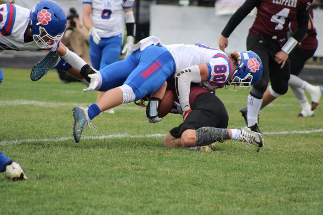 Lenawee Christian's Collin Davis makes a tackle during the regional final game at Martin.