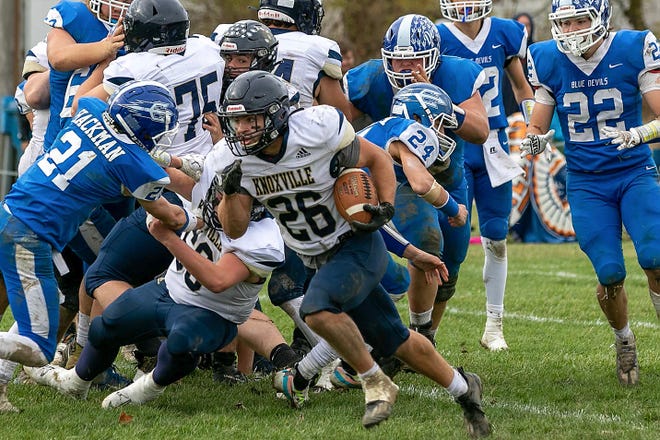 Knoxville running back Jaxin Johnson (no. 26) runs through a huge hole in the line for a long touchdown run during the the Blue Bullets' 48-29 win over Bismarck-Henning Rossville-Alvin in the 2nd round of the Class 2A playoffs on Saturday, Nov. 5, 2022 in Bismarck.