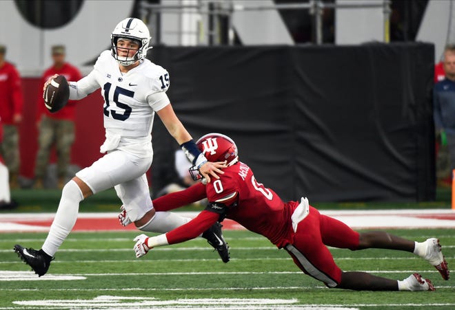 Nov 5, 2022; Bloomington, Indiana, USA; Penn State Nittany Lions quarterback Drew Allar (15) runs the ball past Indiana Hoosiers linebacker Dasan McCullough (0) during the second half at Memorial Stadium. Mandatory Credit: Robert Goddin-USA TODAY Sports