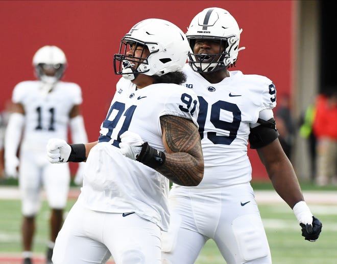 Nov 5, 2022; Bloomington, Indiana, USA; Penn State Nittany Lions defensive tackle Dvon Ellies (91) celebrates with Penn State Nittany Lions defensive tackle Coziah Izzard (99) after a sack during the first half at Memorial Stadium. Mandatory Credit: Robert Goddin-USA TODAY Sports
