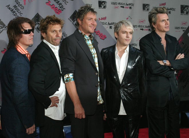 Members of the Duran Duran, from left, Andy Taylor, Roger Taylor, Simon LeBon, Nick Rhodes, and John Taylor, arrive for the MTV Video Music Awards at New York's Radio City Music Hall on Aug. 28, 2003