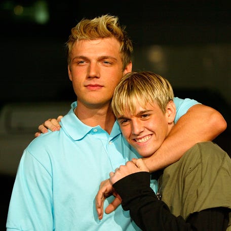 HOLLYWOOD, CA - APRIL 14:  Aaron and Nick Carter (L) aririve for the "Simple Life 2" Welcome Home Party at The Spider Club  on April 14, 2004 in Hollywood, California. (Photo by Frazer Harrison/Getty Images)