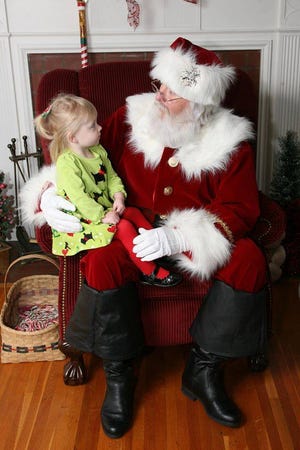 A child visits with Santa during the annual Kings Mountain Breakfast with Santa. The event is returning this year and families will be able to enjoy breakfast, photos with Santa, the elf closet and arts and crafts
