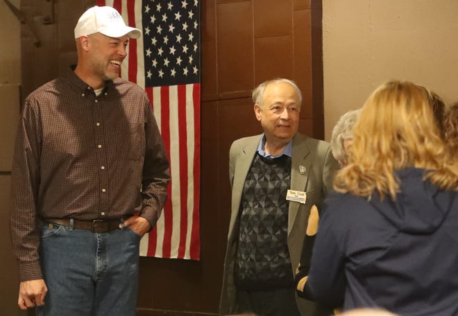 Brian Bengs, left, Democratic candidate for U.S. Senate, and Tom Kool, Democratic candidate for secretary of state, visit with members of the audience during a Sunday campaign visit in Aberdeen.