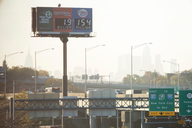 A billboard for Powerball shows the highest lottery payout for $1.9 billion in Lodi, N.J. on Monday Nov. 7, 2022. 