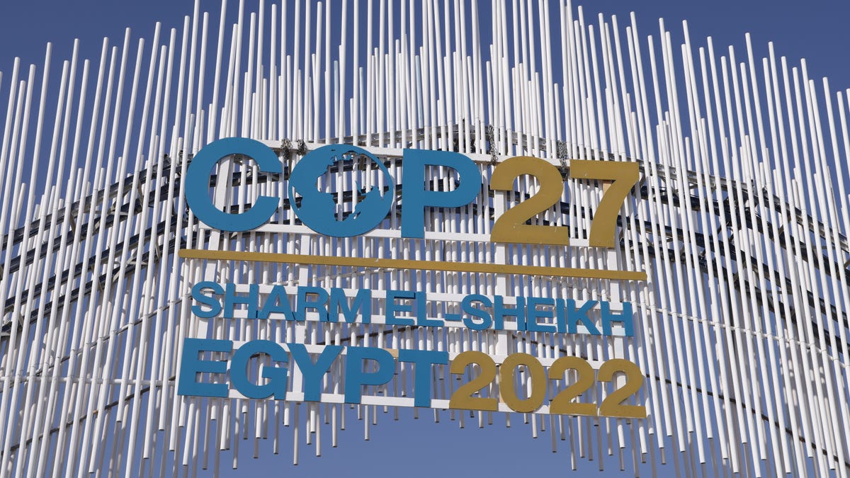 A sign hangs over the main entrance on day two of the UNFCCC COP27 climate conference on November 07, 2022 in Sharm El Sheikh, Egypt.