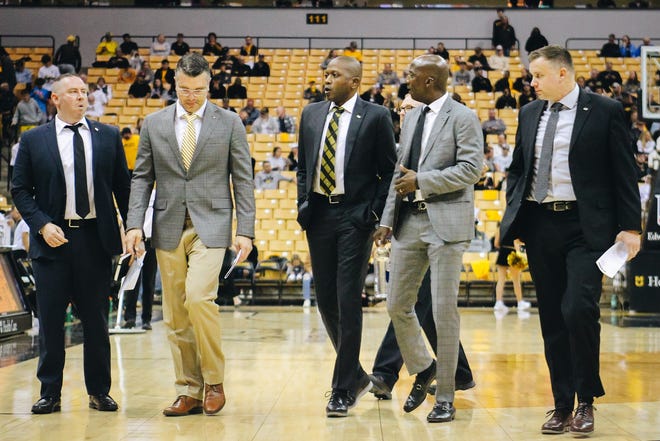 Missouri head coach Dennis Gates (center) walks off the court during the Tigers' 97-91 win over Southern Indiana on Nov. 7, 2022, at Mizzou Arena.