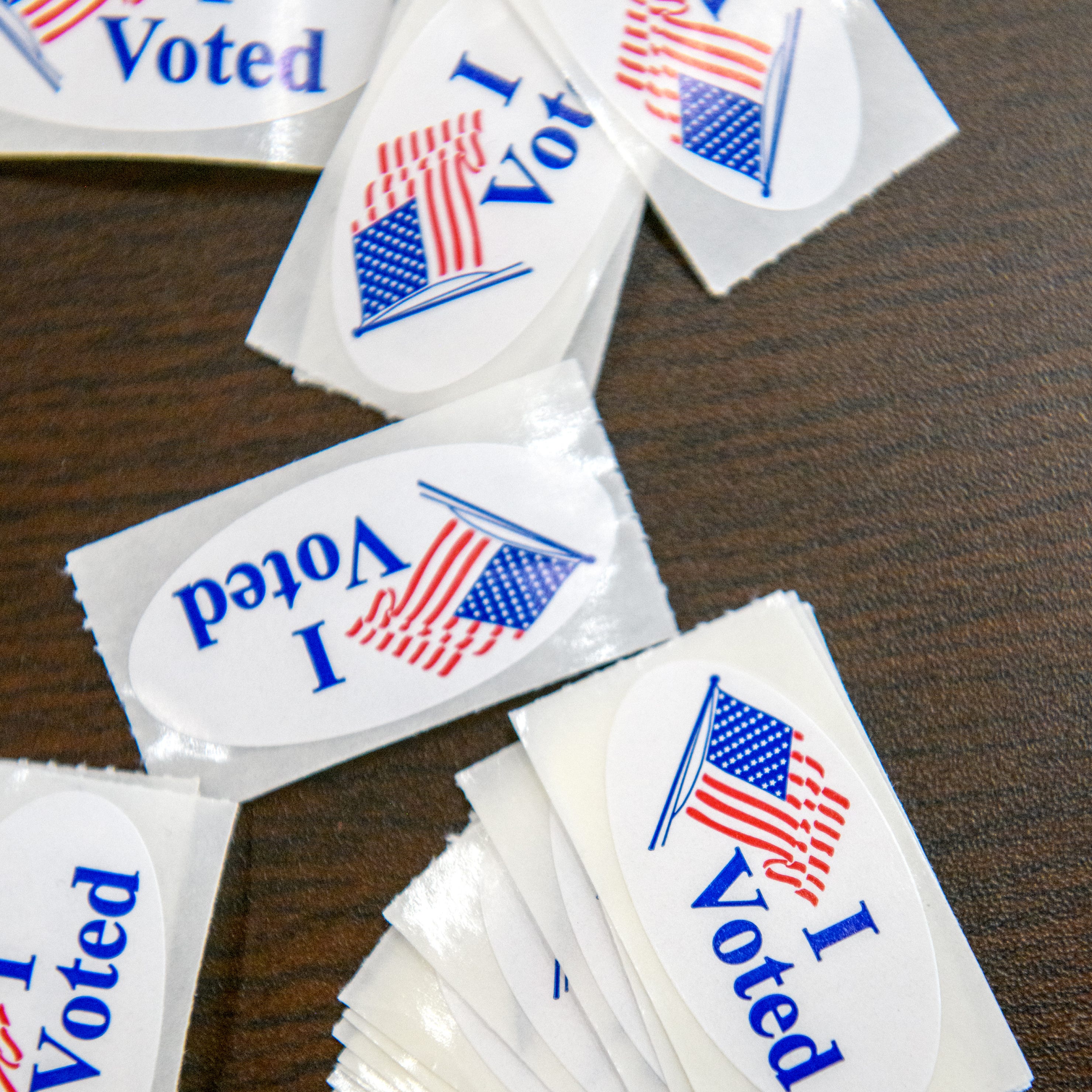 A set of "I Voted" stickers lie on a table Tuesday, Nov. 8 2022 at the Manual High School polling place in Peoria.