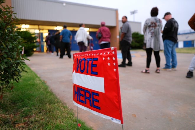 A line forms outside a voting precinct Tuesday in Oklahoma City.