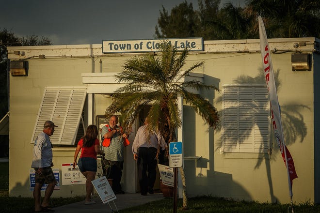 Citizens queue outside as the polls open 7 a.m. on election day in Cloud Lake, Fla., on November 8, 2022.