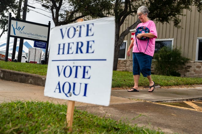 Kristy Golleher returns to her car after voting on Election Day at the Deaf and Hard of Hearing Center in Corpus Christi, Texas, on Tuesday, Nov. 8, 2022.