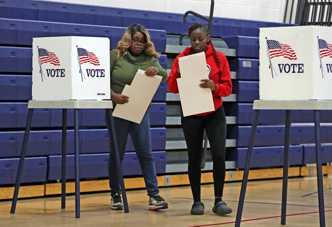 Natiaya Thurmond and her 18-year-old daughter Xiomara, a first time voter, cast their ballots at the Roseville Recreation Center Tuesday, November 8, 2022.